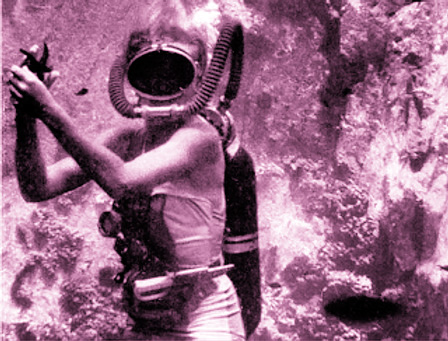 Black and white archival photo of a female diver rendered in purple.